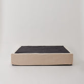 Cosmos Valance cover in Oatmeal fabric, neatly fitted over a Queen bed base.